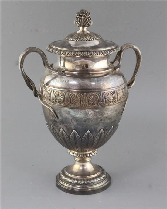 A George IV silver two handled presentation pedestal trophy cup and cover by Benjamin Smith III, 72.5 oz.